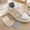 Beige sports shoes with a hole repair at the heel, breathable, lightweight, casual and versatile details Picture